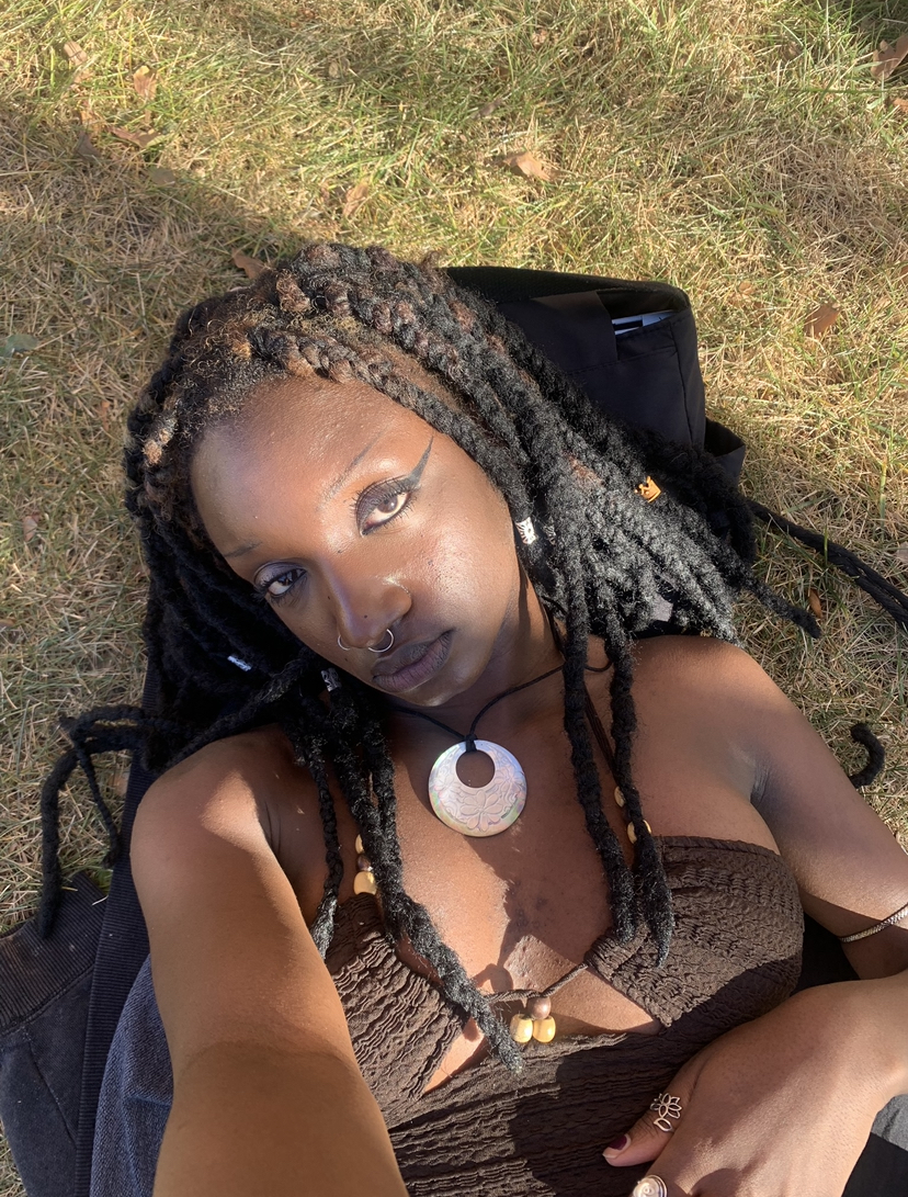 Samona Bleu laying in the grass
