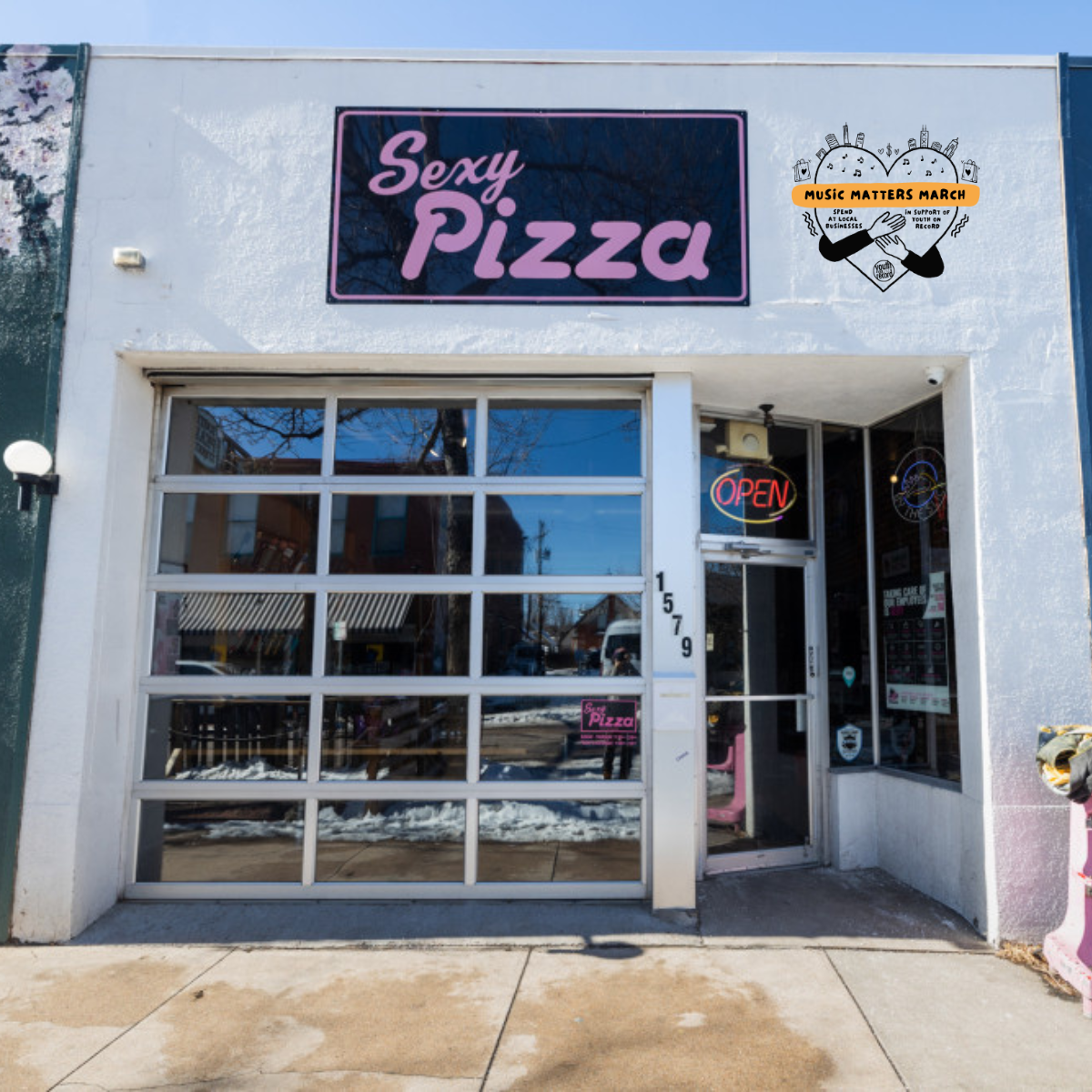 A view of Sexy Pizza South Pearl from the street with the Music Matters March Logo
