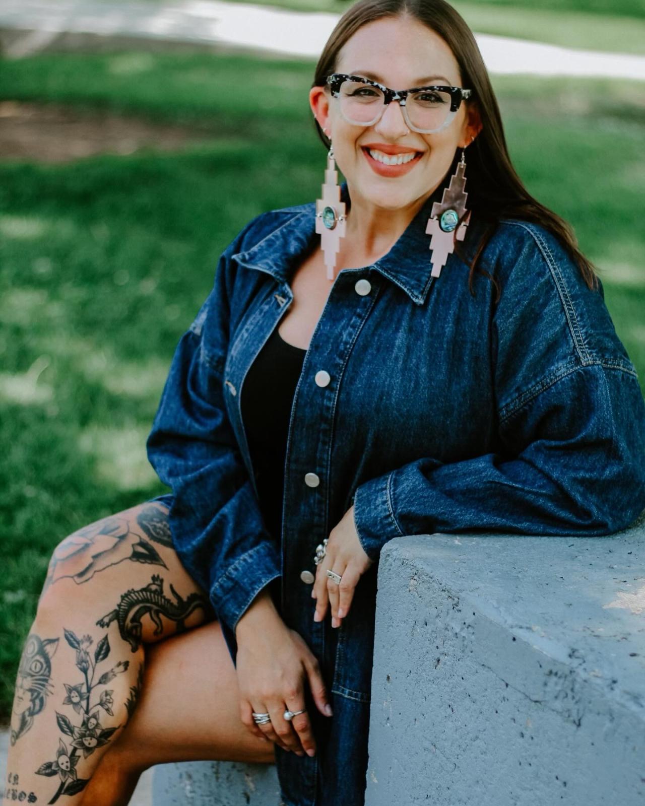 Gavrielle sitting on a bench smiling