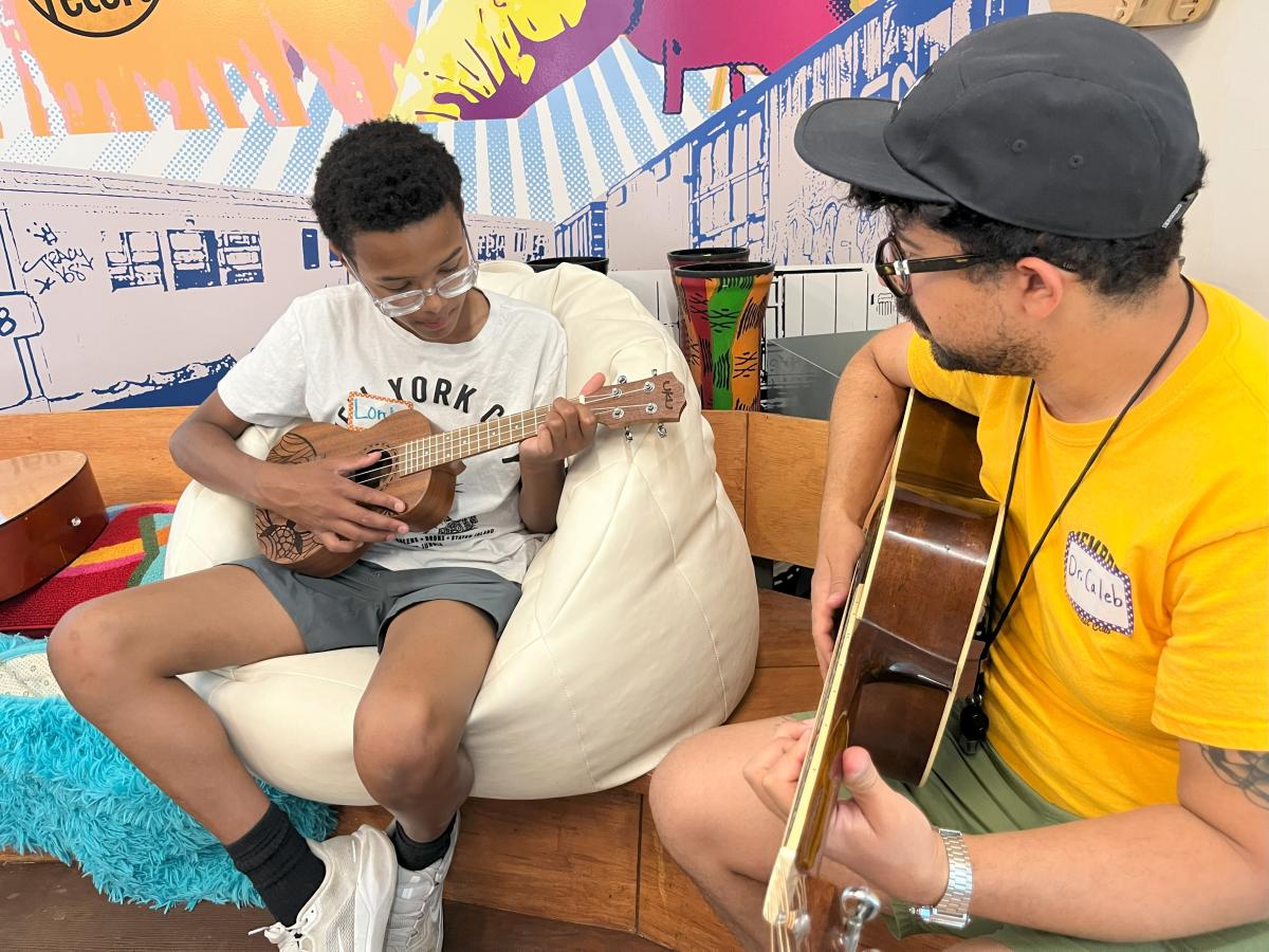 Student learns guitar
