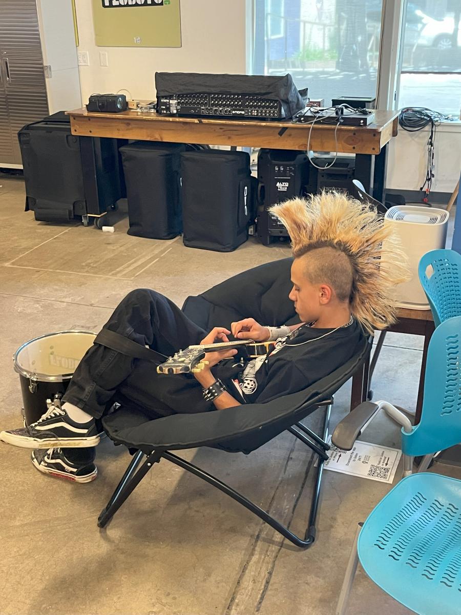 Student plays guitar