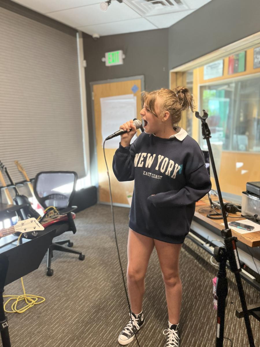 Student sings into mic