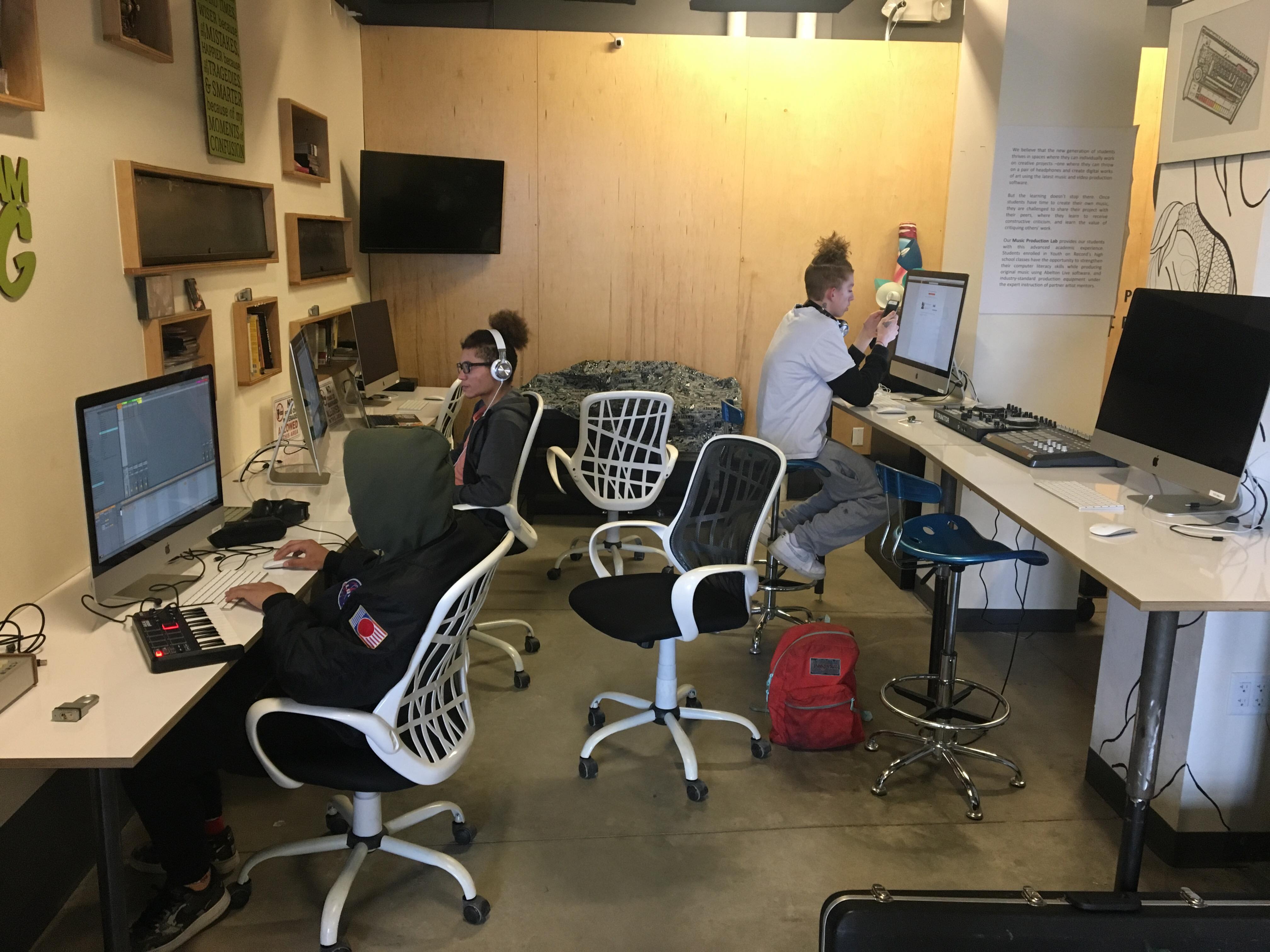 Open Lab students producing instrumentals and writing songs in the Big Gigantic iMac Lab.