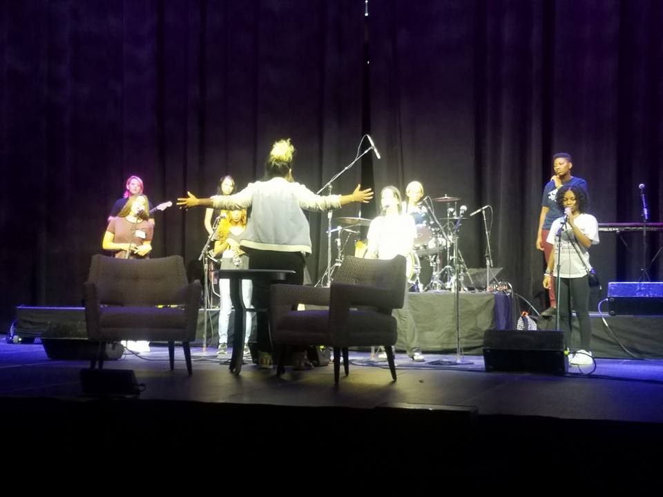 Michelle Rocqet with her students performing at the Pepsi Center before Michelle Obama