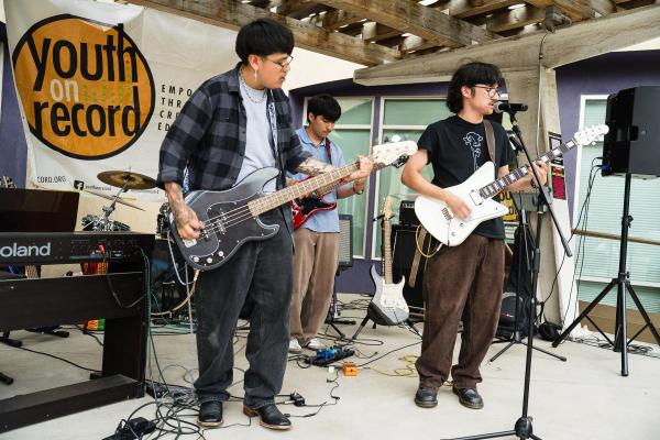 Youth perform on an outdoor stage at YOR Block Party
