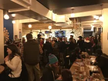 A full taproom at the Intrepid Sojourner Beer Project