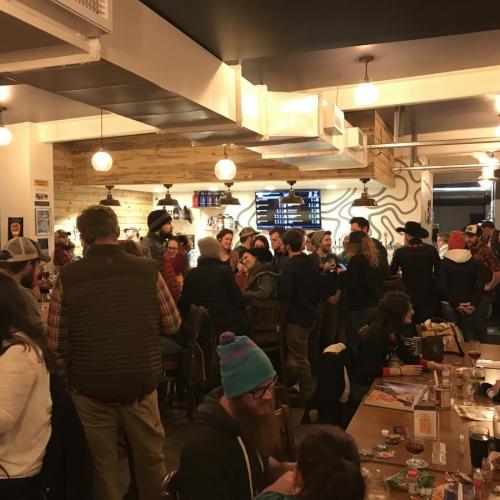 A full taproom at the Intrepid Sojourner Beer Project