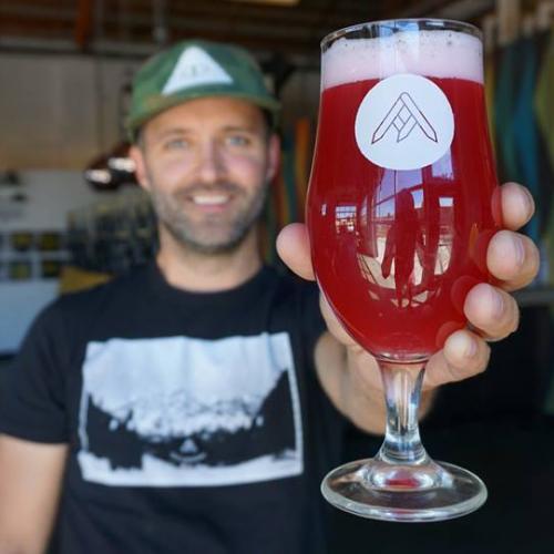 Jason zumBrunnen from Ratio Beerworks, holding a glass of beer