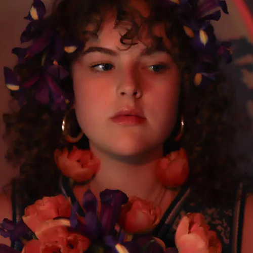 sofia young holding a bouquet of flowers