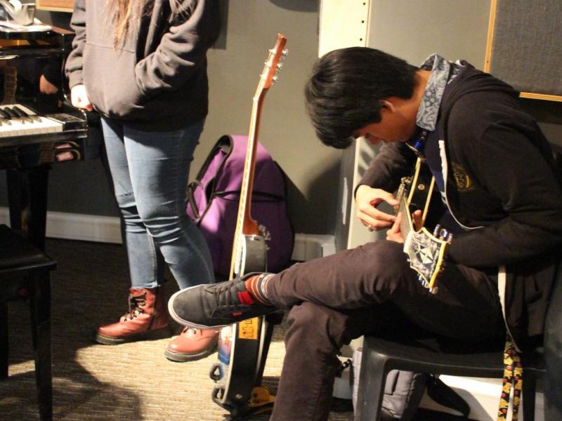 Student playing guitar