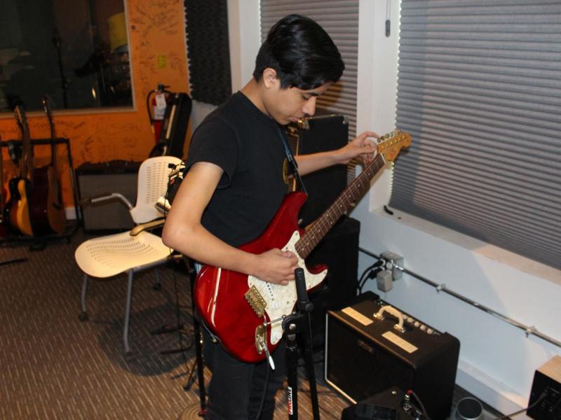 Student playing guitar